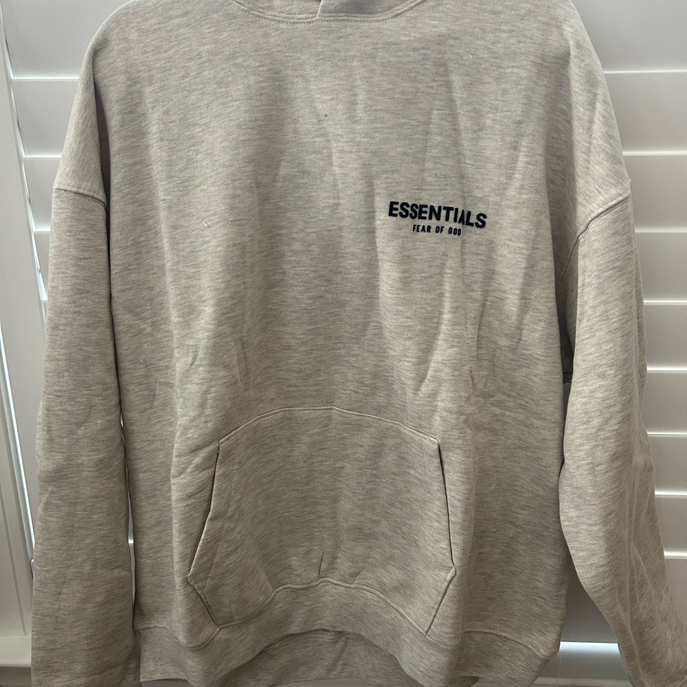 Fear of God ESSENTIALS Light Beige Hoodie with Black Logo